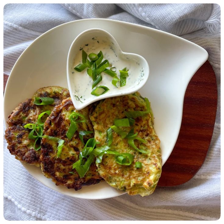 delicious zucchini fritters served with sour cream dip