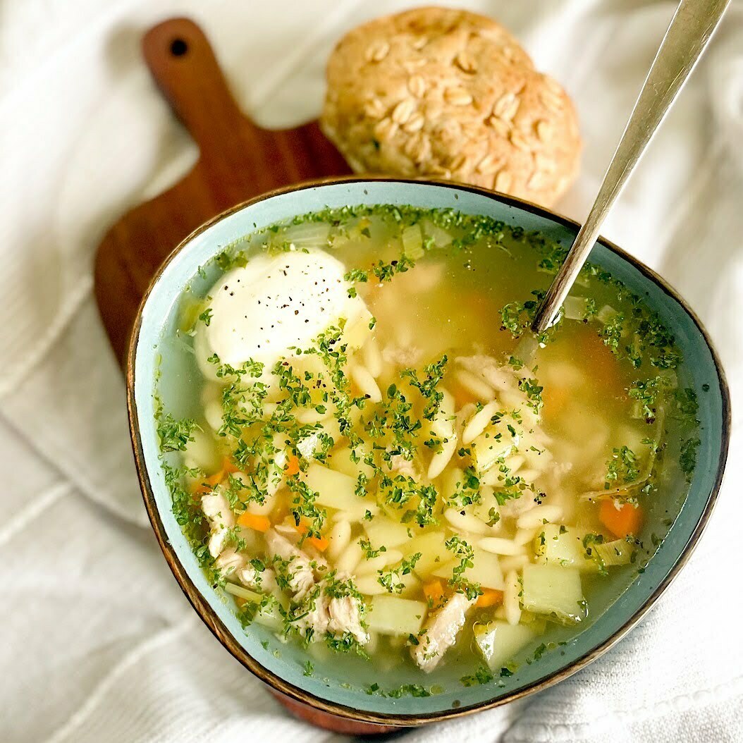 Bowl of soup made with rich pork bones stock, garnished with fresh parsley.
