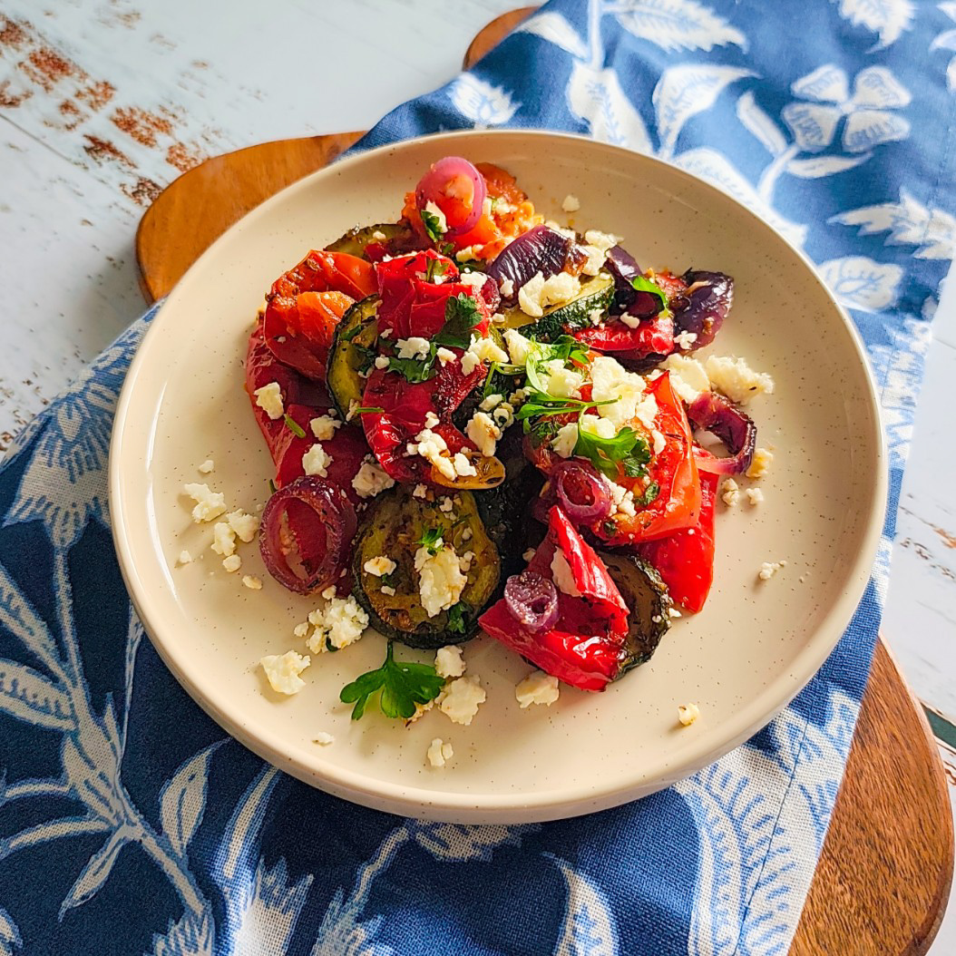 Freshly roasted summer vegetables with caramelised peppers and onions, finished with feta and parsley.