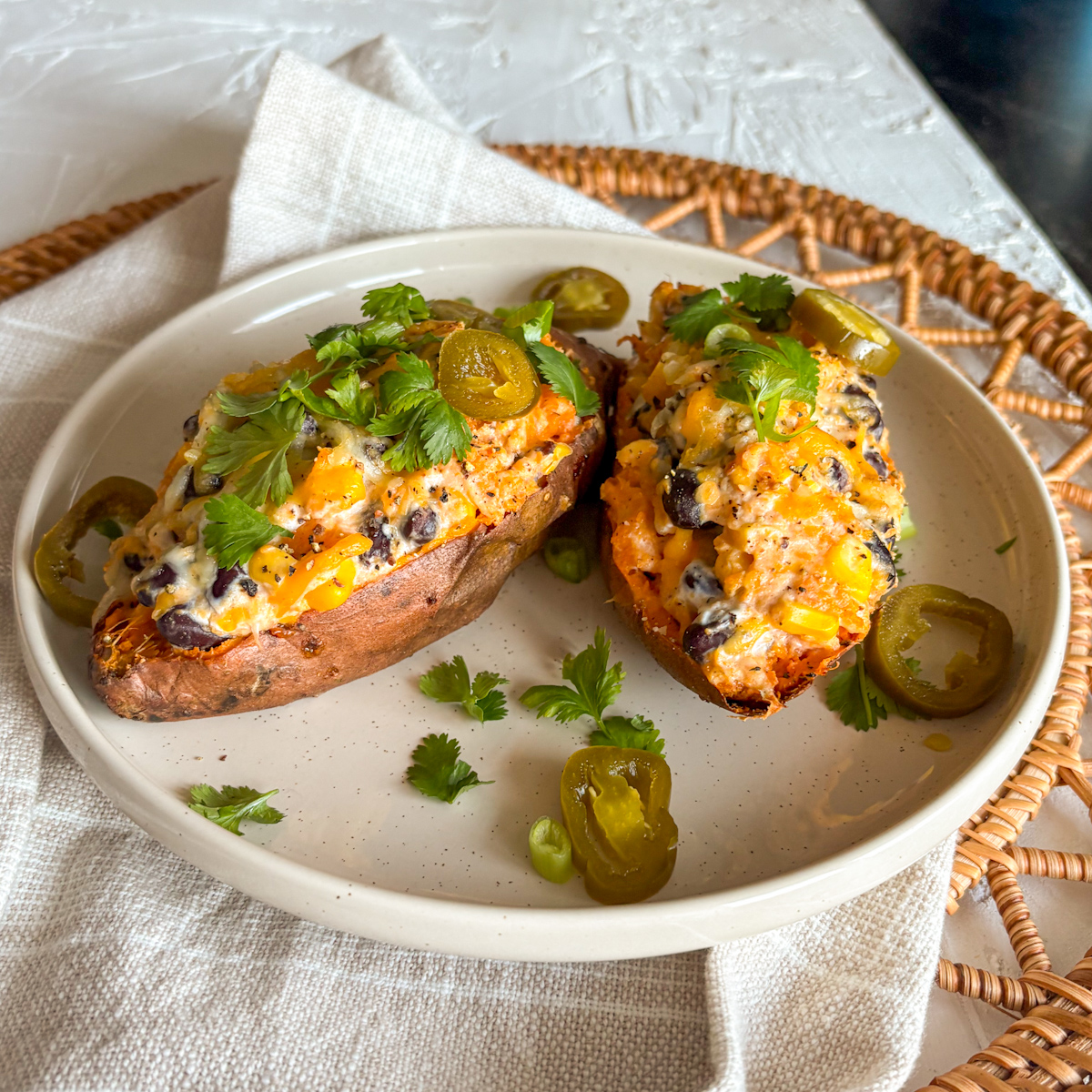 Easy recipe loaded sweet potatoes served with jalapeños and fresh coriander leaves
