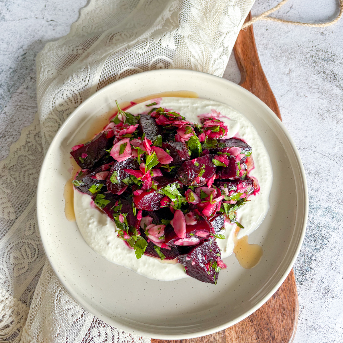 Beetroot salad with horseradish cream, showcasing vibrant roasted beets and fresh herbs