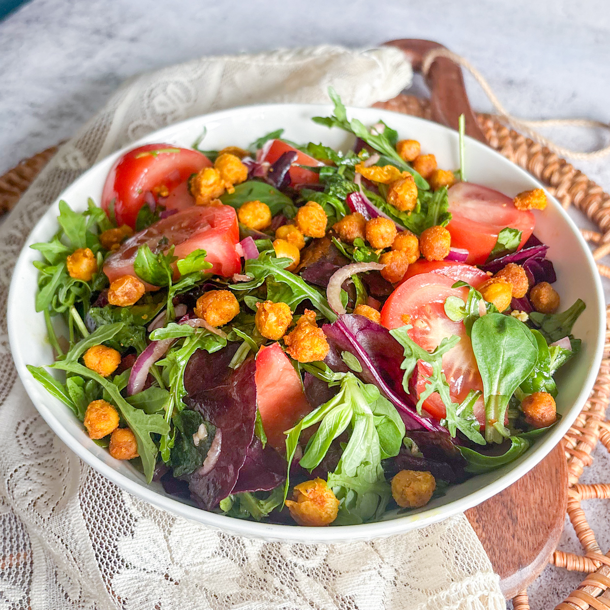 A simple salad recipe with roasted chickpeas, showing a satisfying crunchiness and fresh vegetables.