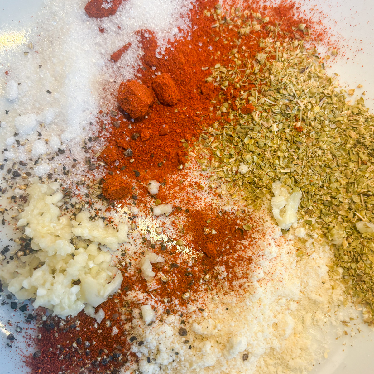  Spice mix for pantry staples chicken wings — paprika, oregano, garlic, onion salt and pepper.