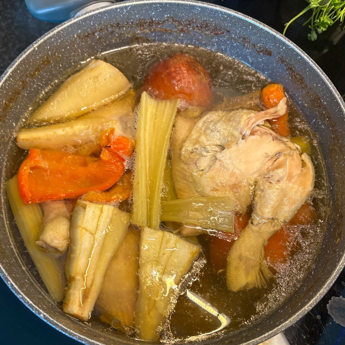  Cooked chicken and vegetables in pot for Russian chicken soup stock