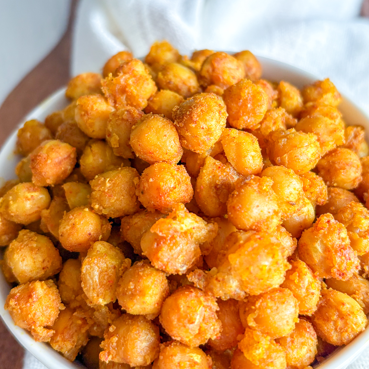 Extreme close-up highlighting the crunchy, golden texture of perfectly fried chickpeas.