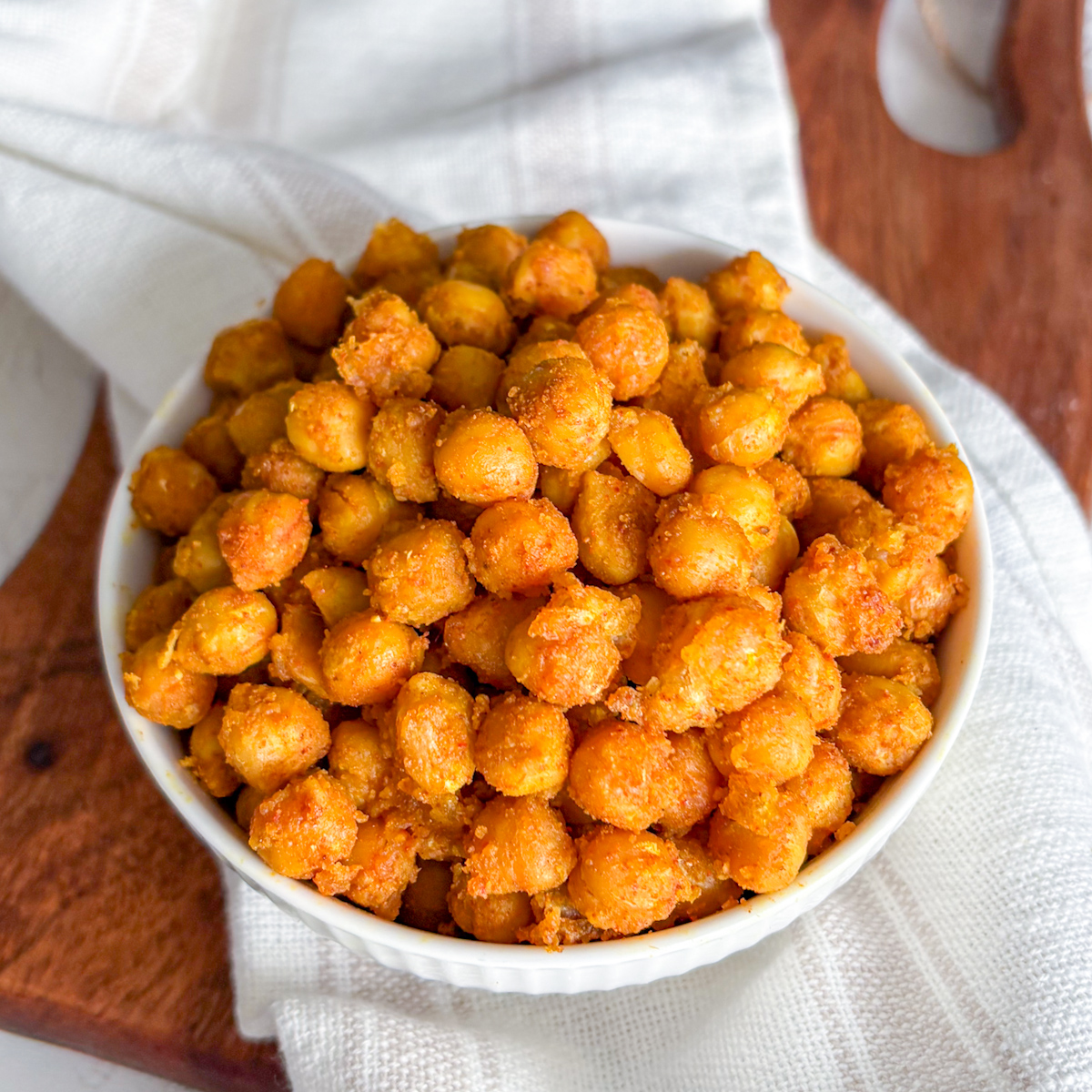 A beautiful stack of golden, crunchy pan-fried chickpeas, demonstrating how to make delicious spiced chickpeas without an oven.