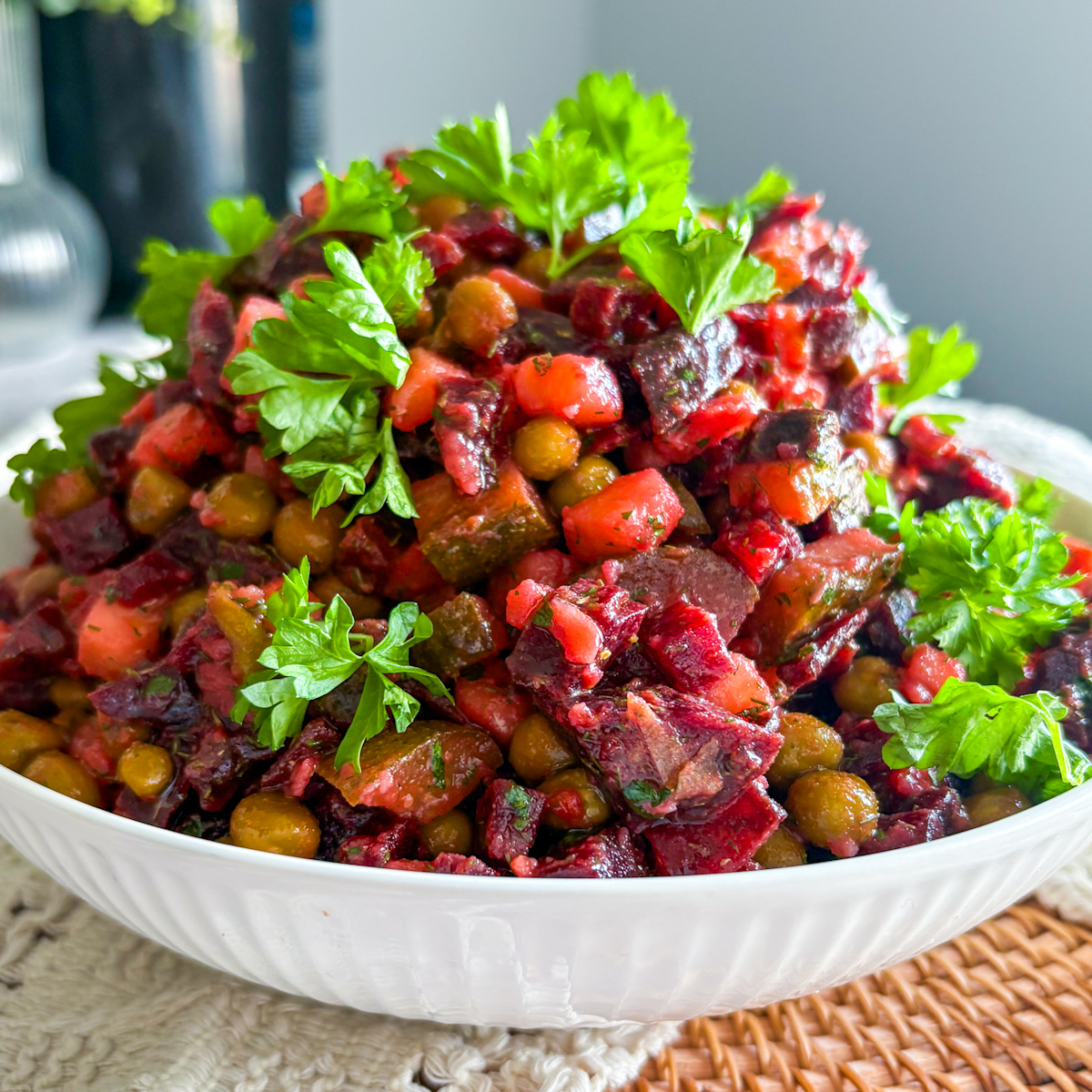 Close-up of Russian vinaigrette salad topped with fresh parsley