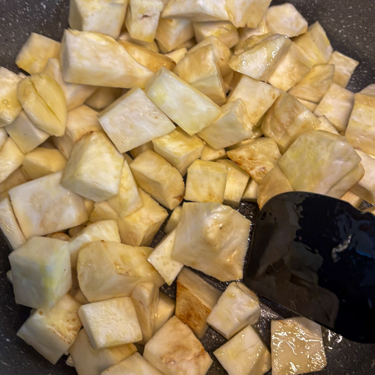 Peeled and cubed celeriac in a pan ready to cook for celeriac purée