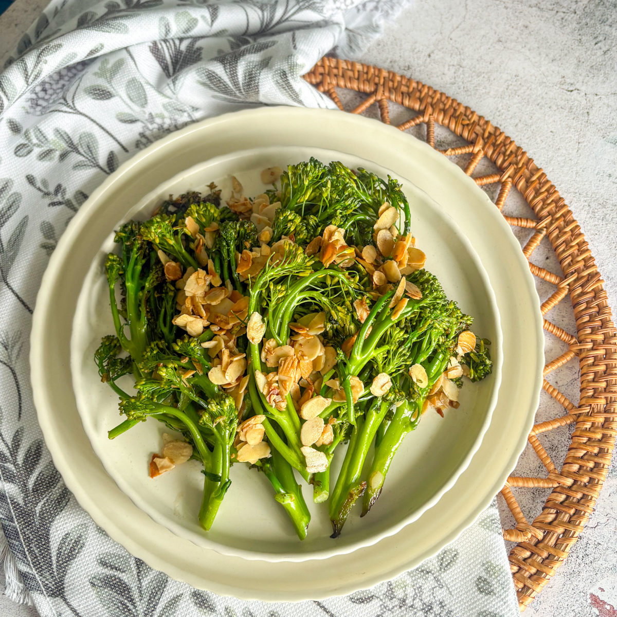 Overhead view of charred broccolini recipe topped with toasted sliced almonds