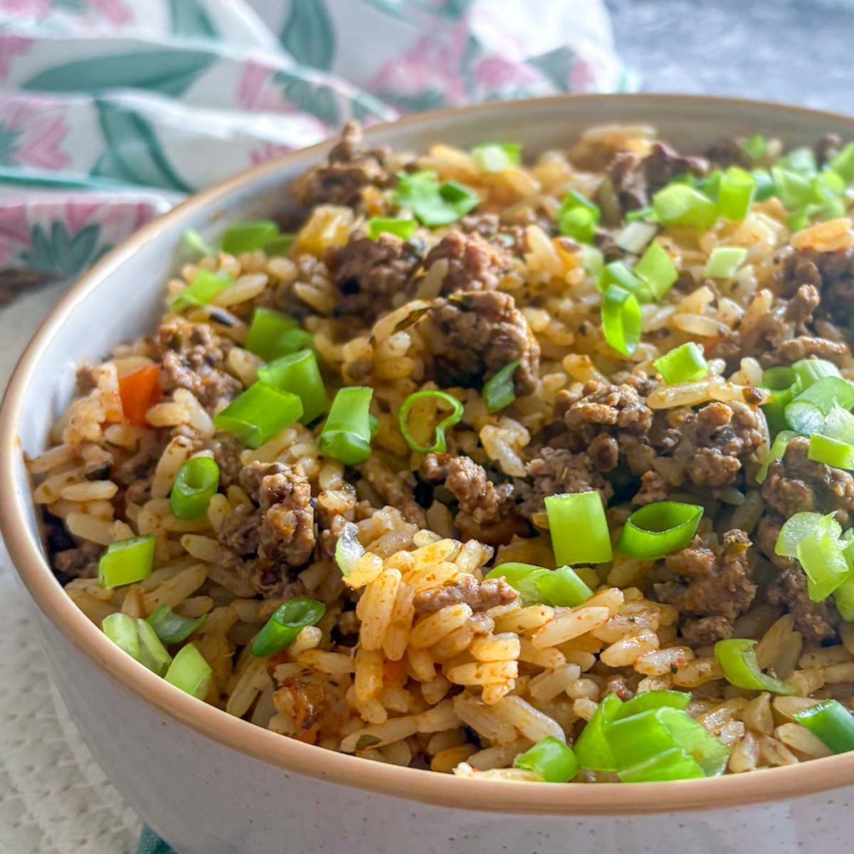 Close-up of dirty rice with beef mince showing tender mince and fluffy rice