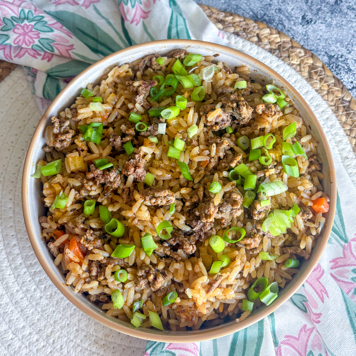 Overhead bowl of dirty rice with beef mince and diced vegetables