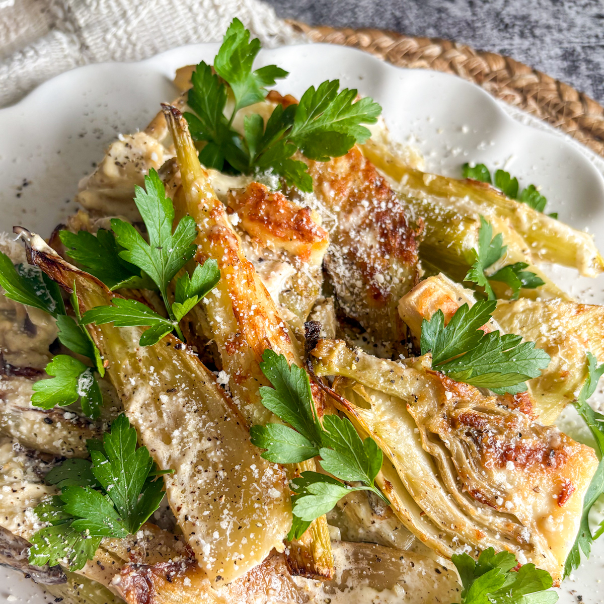 Easy baked fennel recipe served with parsley garnish overhead