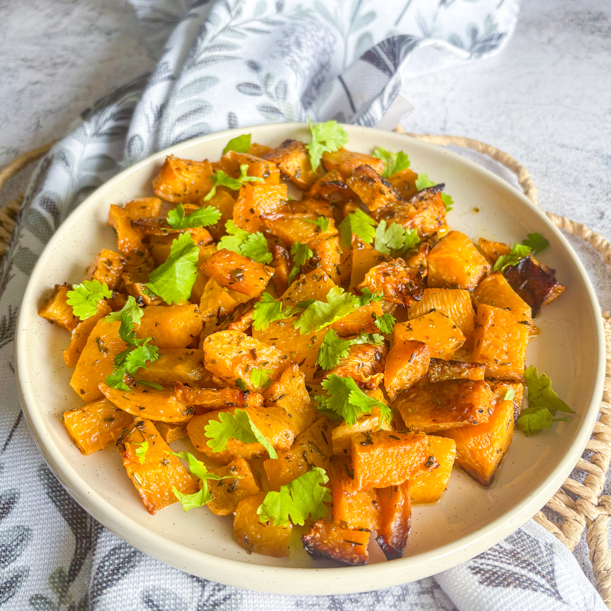 Crispy roasted turnips with golden edges on a plate with parsley garnish