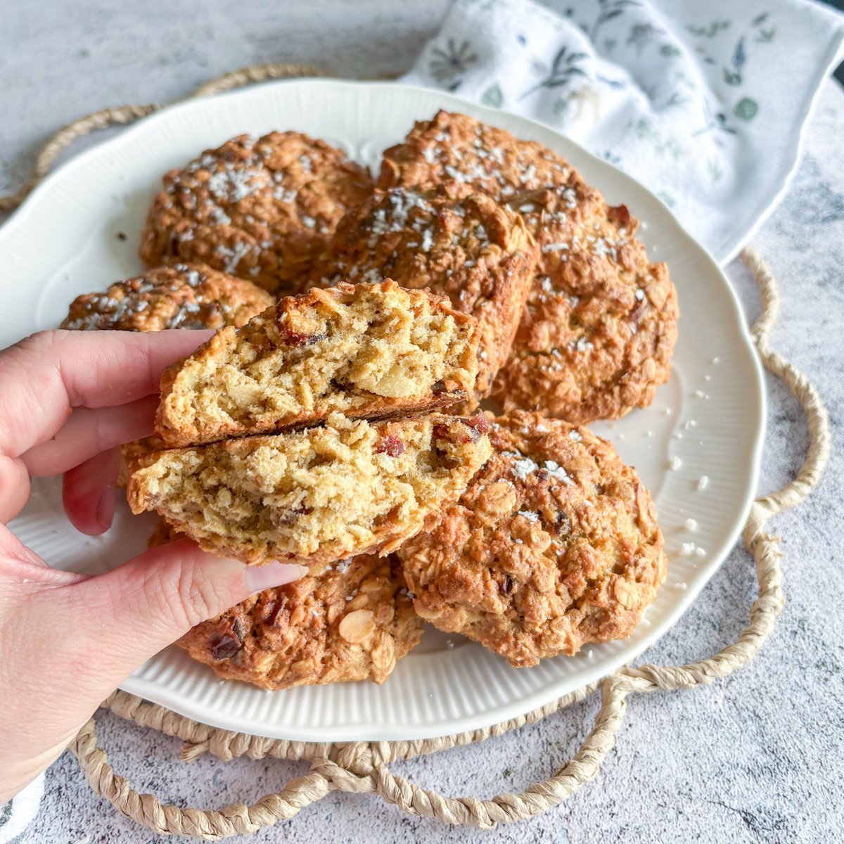 Close-up of oatmeal cookies with dates split in half, showing dates and almonds inside