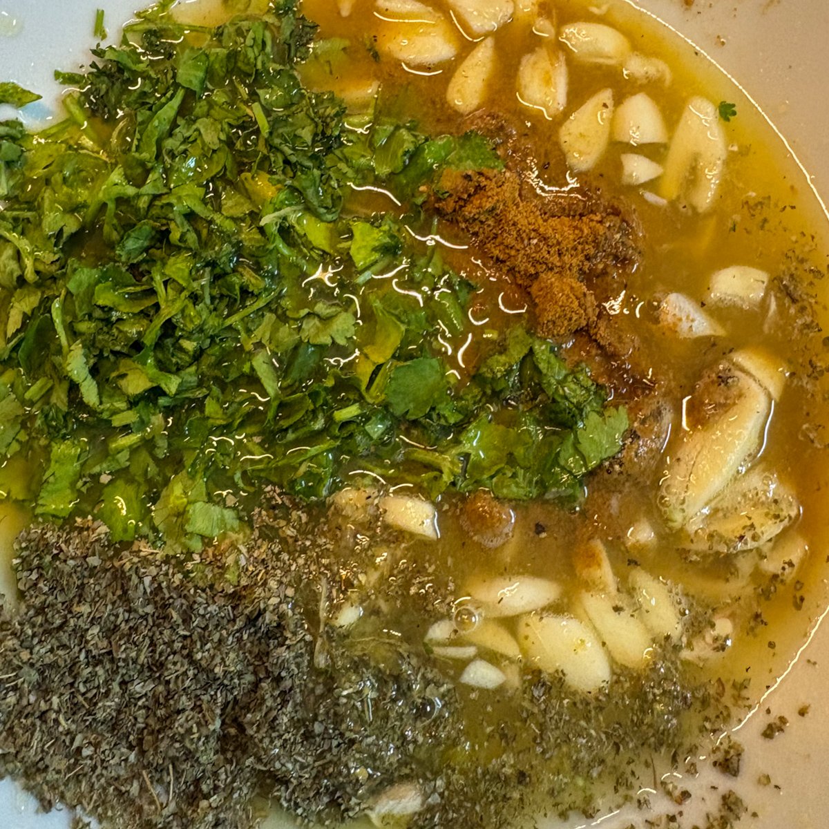Cuban mojo pork marinade with garlic, fresh coriander, cumin, oregano and citrus juice