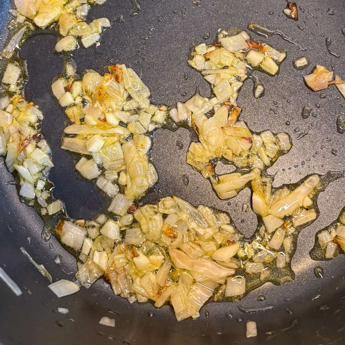 Onions and garlic sautéing for easy chickpeas in tomato sauce
