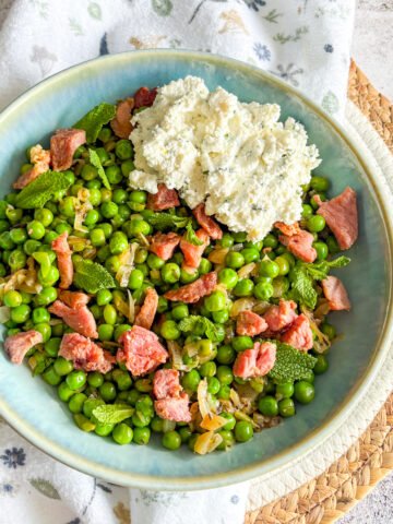 Overhead peas with bacon and ricotta topped with mint and a scoop of lemon ricotta