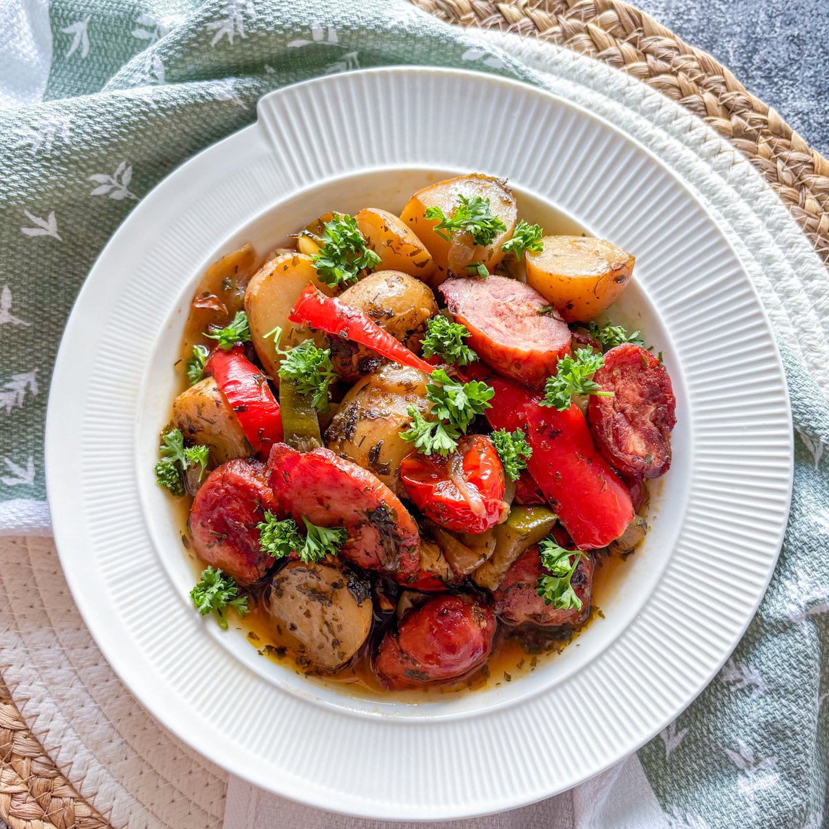  Summer sausage and potato stew with kielbasa, sweet peppers and courgette in a herby broth