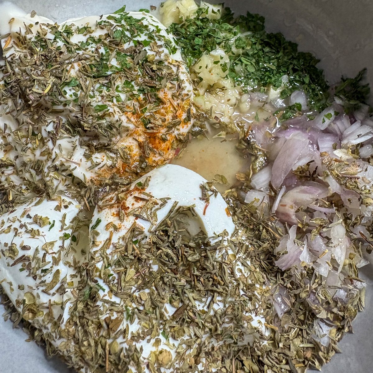 Dressing ingredients for summer pasta salad recipe — yogurt, herbs, garlic and shallot