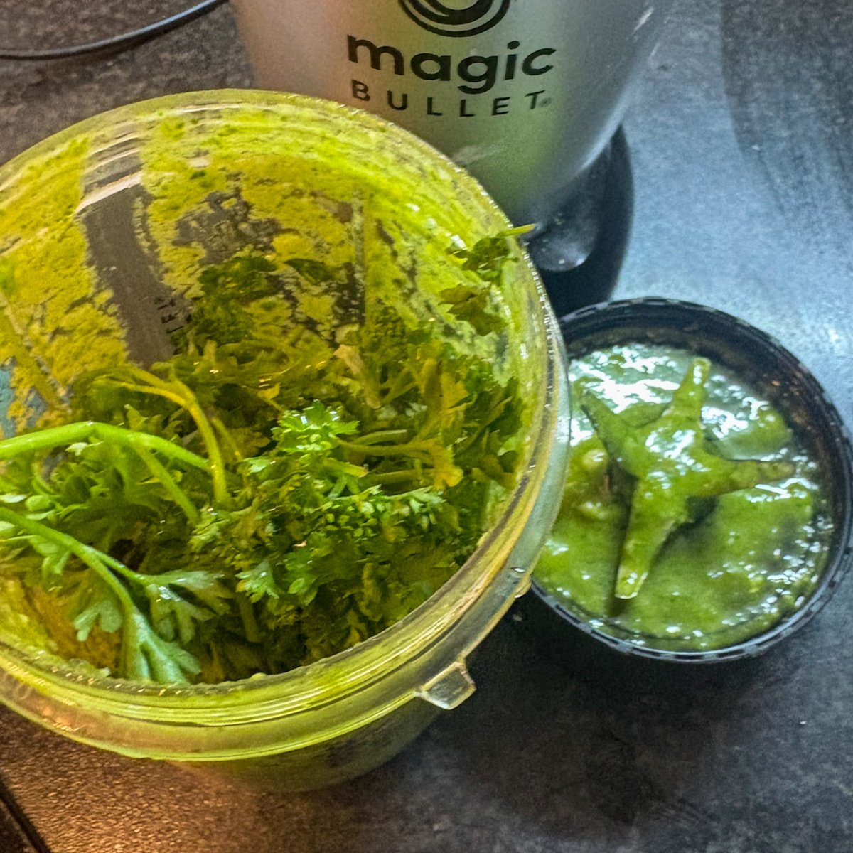 Fresh basil and parsley pesto blended in a Magic Bullet cup for homemade pesto pasta salad