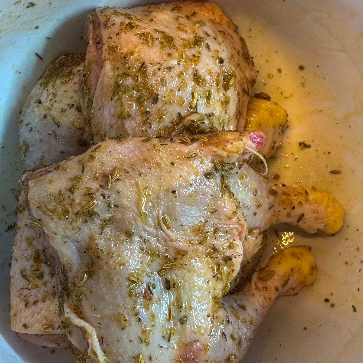 Raw seasoned chicken legs with fennel and herb rub for chicken legs with vegetables